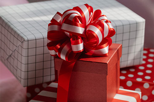 Bright red boxes of presents with ribbons